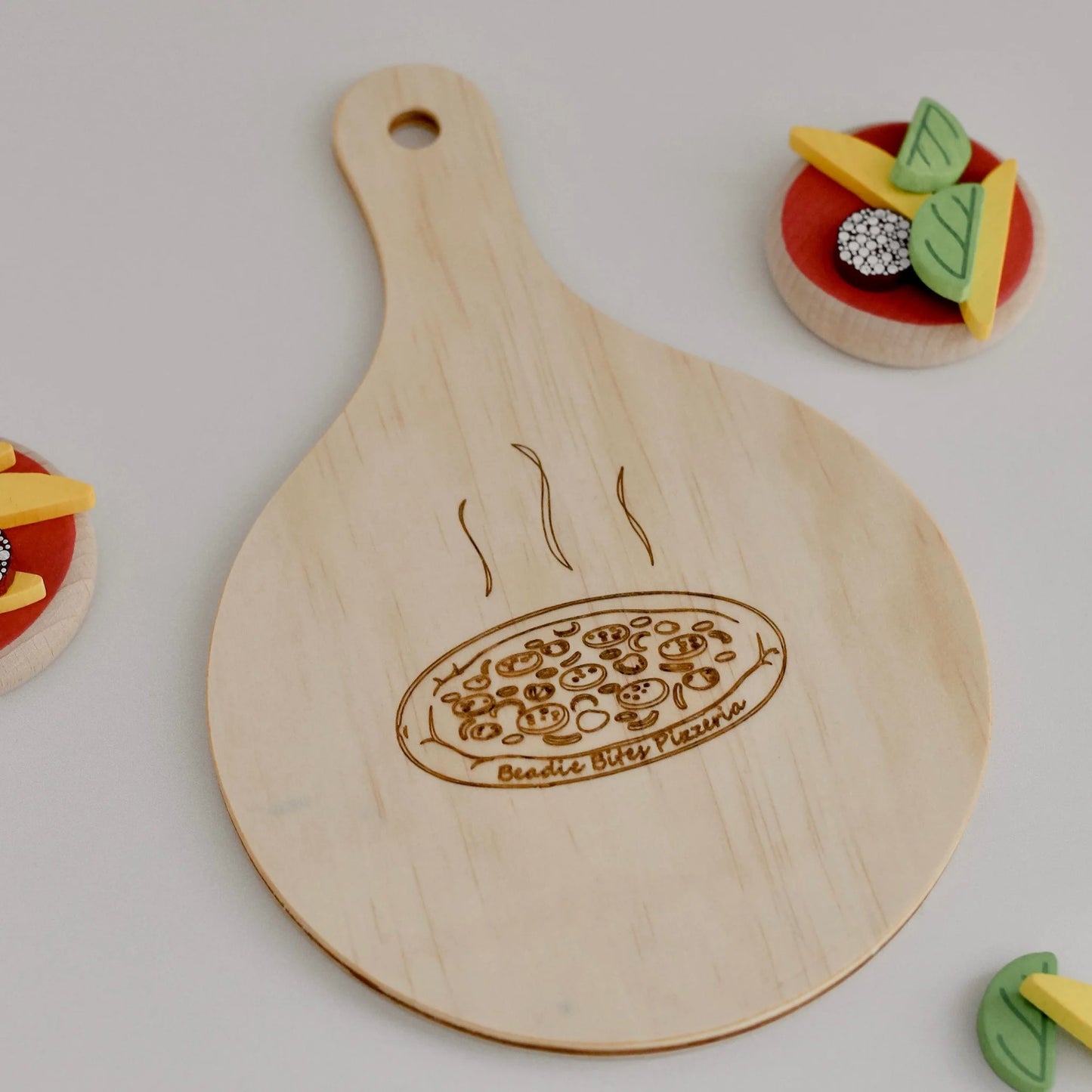 
                  
                    Beadie Bites - Wooden Pizza Paddle
                  
                