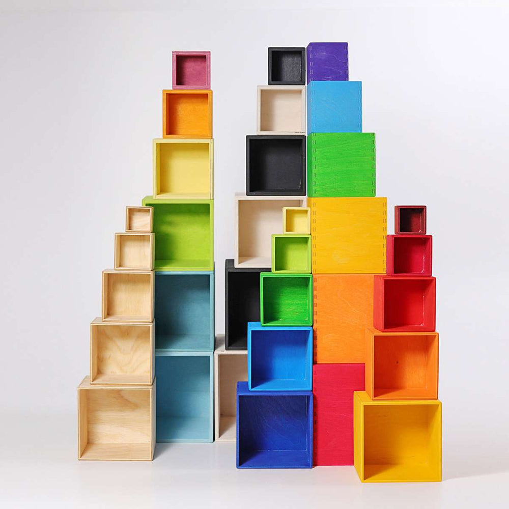 
                  
                    Grimm's Natural Stacking Boxes with Coloured Little Toy Tribe
                  
                